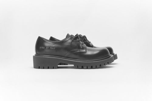 Woman by Common Projects